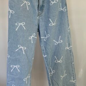 Elegant Light Blue Jeans with White Bow Design